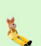 Figurica s visećim nogama cca 6 × 5 × 10 cm